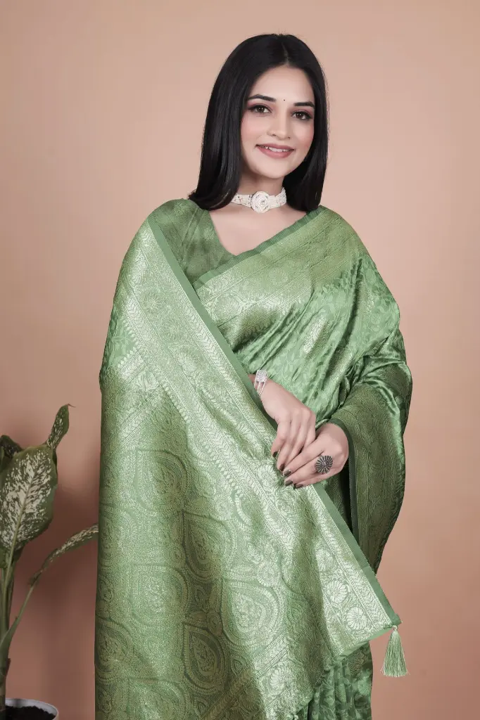 Fabric: Premium Banarasi Silk Color: Light Green with Golden Zari Work