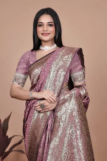 Color: Royal Purple with Multicolor Pallu  Fabric: Premium Banarasi Silk  Design: All-over golden motifs with zari woven border  Pallu: Artistic peacock-themed design in vibrant hues  Occasion: Festive, Wedding, Traditional Events  Saree Length: 5.5 meters | Blouse Piece: 08 meters (matching with border)